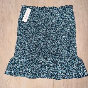 New Francesca’s blue, green, and white flower patterned smocked skirt